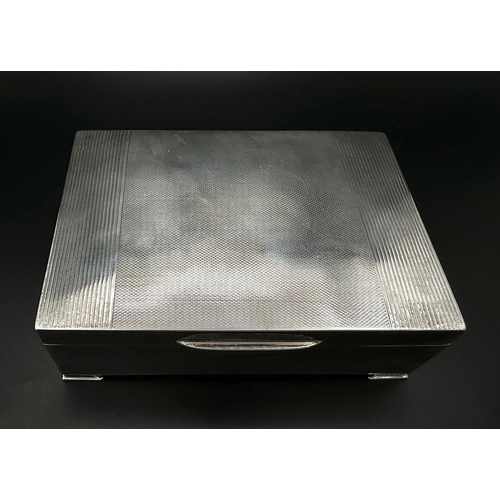 774 - A Vintage Sterling Silver Cigarette Case. Wood interior and weighted. 360g total weight. 13 x 9cm.