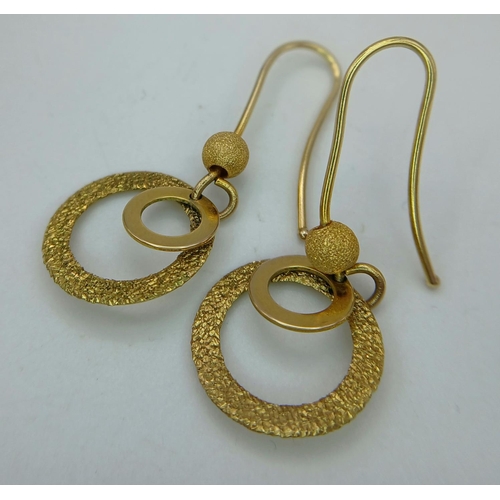 91 - Genuine Trevor Hobbs 9 carat GOLD DESIGNER EARRINGS. Drop style having smooth and frosted Gold Hoops... 