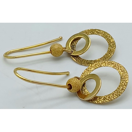 91 - Genuine Trevor Hobbs 9 carat GOLD DESIGNER EARRINGS. Drop style having smooth and frosted Gold Hoops... 