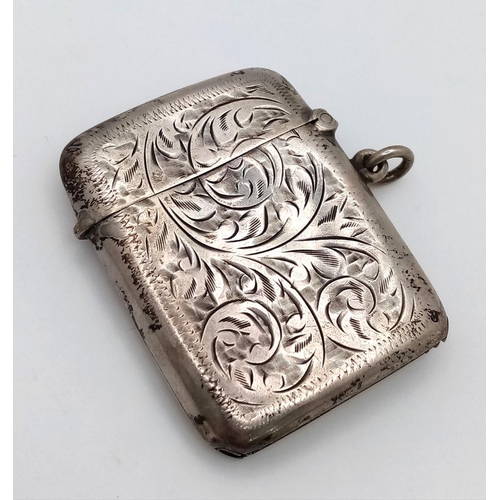 919 - A Sterling Silver Vesta Case. Hallmarks for Birmingham 1945.
4.5 x 3.5cm. 25g