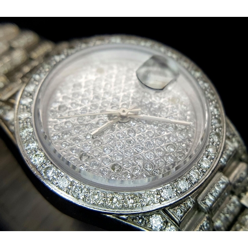 111 - A spectacular ladies ROLEX DATEJUST watch with 18 K white gold case and bracelet covered with pave r... 