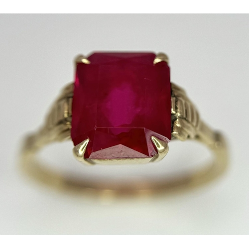 120 - A 9K Yellow Gold (tested) Ruby Ring. Size N 1/2. 2.6g total weight.