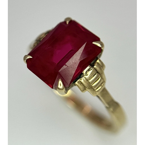 120 - A 9K Yellow Gold (tested) Ruby Ring. Size N 1/2. 2.6g total weight.