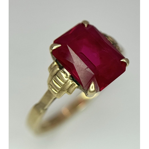 120 - A 9K Yellow Gold (tested) Ruby Ring. Size N 1/2. 2.6g total weight.