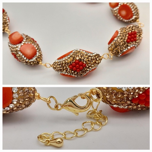 146 - A very fashionable red coral necklace and earrings set in a presentation box. Necklace length: 46-50... 