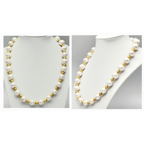 153 - A white pearl necklace and earrings set in a presentation box. The natural pearls are of good size (... 