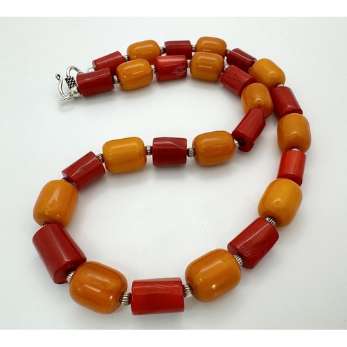 223 - A vintage - and still in vogue - red coral and orange amber Bakelite necklace, bracelet and earrings... 