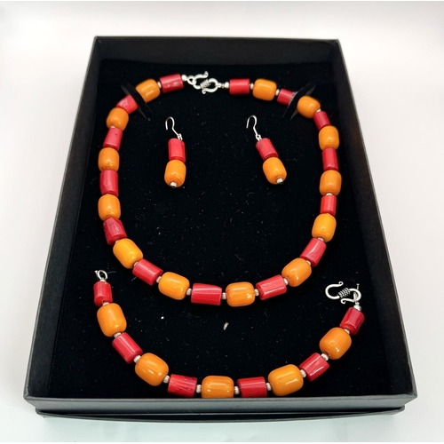 223 - A vintage - and still in vogue - red coral and orange amber Bakelite necklace, bracelet and earrings... 