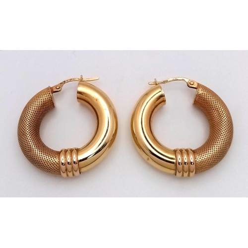 24 - A Pair of Stylish 9K Yellow Gold Creole Hoop Earrings. 27mm diameter. 4.4g. Some small indentations ... 