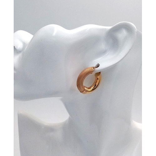 24 - A Pair of Stylish 9K Yellow Gold Creole Hoop Earrings. 27mm diameter. 4.4g. Some small indentations ... 