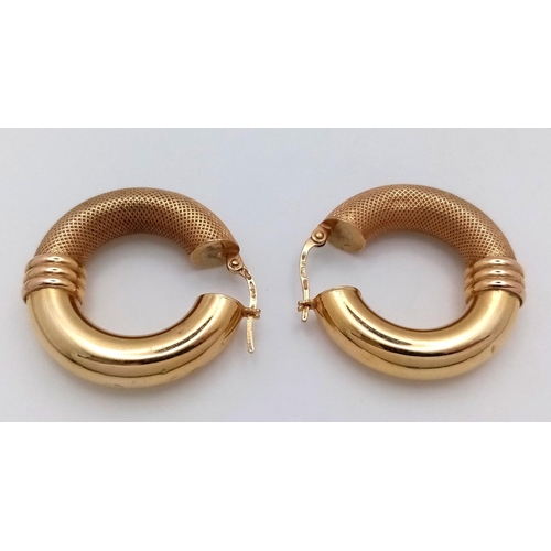 24 - A Pair of Stylish 9K Yellow Gold Creole Hoop Earrings. 27mm diameter. 4.4g. Some small indentations ... 