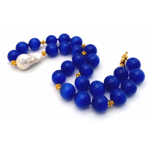 288 - An Exotic Blue Cat's Eye Necklace With White Baroque Pearl Accent. Large rich 14mm beads. Gilded spa... 