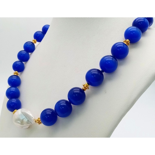 288 - An Exotic Blue Cat's Eye Necklace With White Baroque Pearl Accent. Large rich 14mm beads. Gilded spa... 