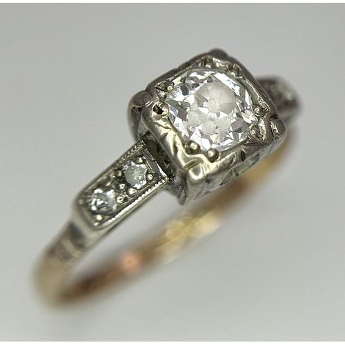 568 - A Vintage 18K Yellow Gold and Platinum Diamond Ring. 0.75ct central diamond with diamond accents. Si... 