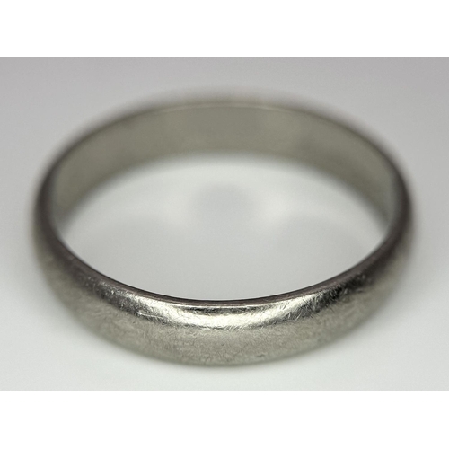 64 - A Vintage 18K White Gold Band Ring. 5mm width. Size S. 5.3g weight. Full UK hallmarks.