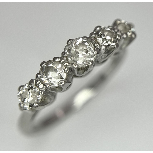 94 - An 18K White Gold Five Stone Diamond Ring. 0.90ctw of brilliant round cut diamonds approx. Size O. 3... 