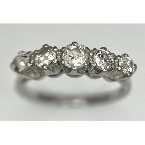 94 - An 18K White Gold Five Stone Diamond Ring. 0.90ctw of brilliant round cut diamonds approx. Size O. 3... 