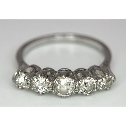 94 - An 18K White Gold Five Stone Diamond Ring. 0.90ctw of brilliant round cut diamonds approx. Size O. 3... 