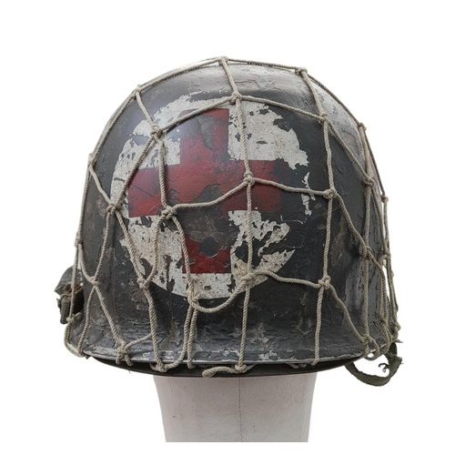 208 - WW2 US Medics Helmet. With a Capac Liner. Both Helmet and liner bear the red cross insignia. The hel... 