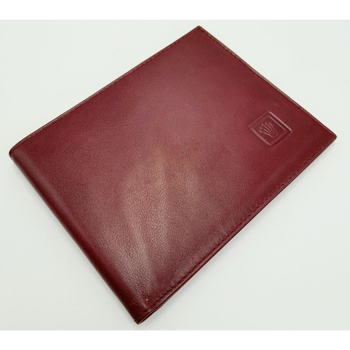 423 - An Unused Burgundy Leather Rolex Bank Notes & Card Wallet. Bi-Fold. 12x9.5cm Folded.