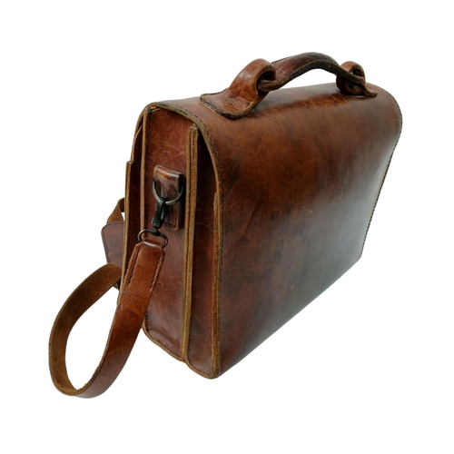 1079 - A HAND MADE OVERSIZED LEATHER SATCHEL MADE BY 