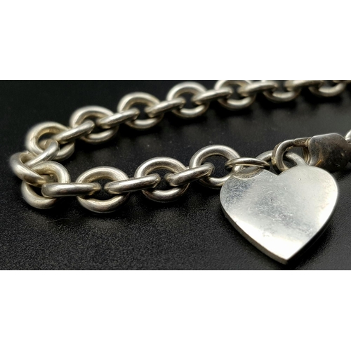 870 - An attractive Solid Silver 925 Belcher Chain Bracelet with a heart charm, 30.7g total weight, 21cm l... 