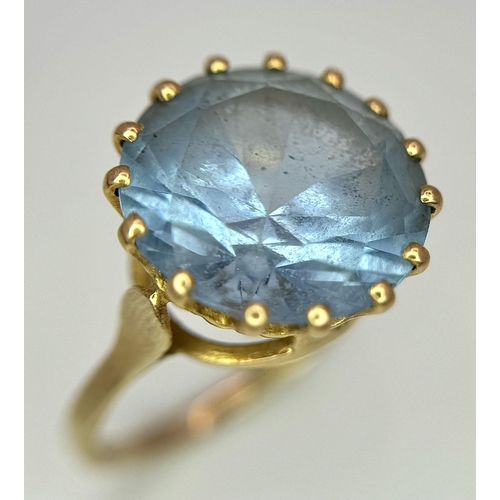 295 - A 9K Yellow Gold Aquamarine Ring. Central round cut 5ct aquamarine. Size L 1/2. 4.2g total weight. 0... 