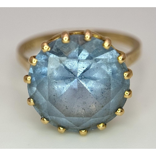 295 - A 9K Yellow Gold Aquamarine Ring. Central round cut 5ct aquamarine. Size L 1/2. 4.2g total weight. 0... 