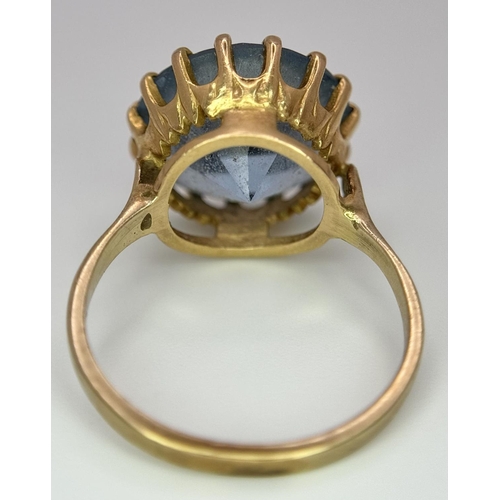 295 - A 9K Yellow Gold Aquamarine Ring. Central round cut 5ct aquamarine. Size L 1/2. 4.2g total weight. 0... 