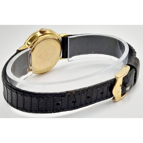 1156 - A Classic Gucci Gold Plated Ladies Quartz Watch. Black leather strap. Gilded case - 26mm. Black dial... 