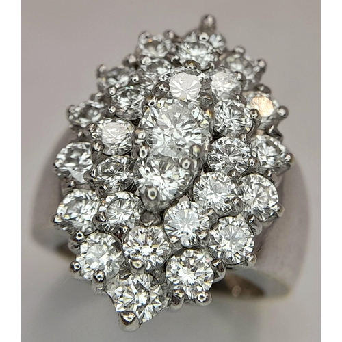 1136 - A Browns Designer 18K White Gold Diamond Ring. Marquise shape with a wonderful mix of quality brilli... 