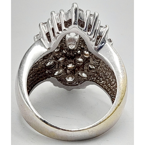 1136 - A Browns Designer 18K White Gold Diamond Ring. Marquise shape with a wonderful mix of quality brilli... 