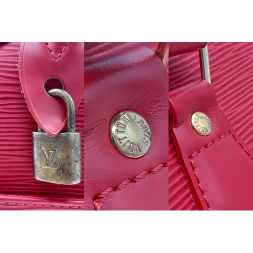 438 - A Louis Vuitton Red Speedy Bag. Epi leather exterior with gold-toned hardware, two rolled leather ha... 