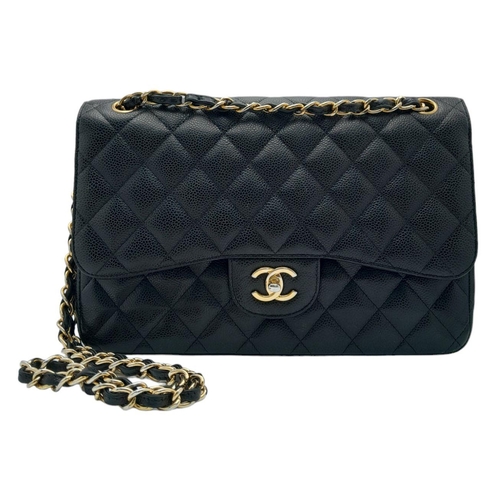 5 - A Chanel Black Classic Double Flap Bag. Quilted leather exterior with gold-toned hardware, chain and... 