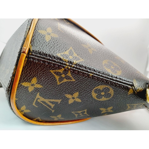 234 - A Louis Vuitton Ellipse Handbag. Monogram canvas exterior with leather trim, two rolled leather hand... 