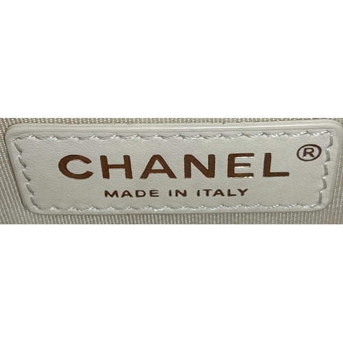 220 - A Chanel Red Boy Bag. Quilted leather exterior with gold-tone hardware, leather and chain strap and ... 