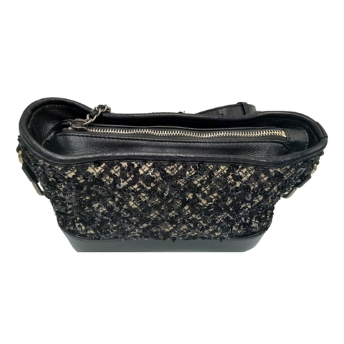 213 - A Chanel Black and Cream Sequin Gabrielle Bag. Leather, textile and sequin exterior with silver and ... 