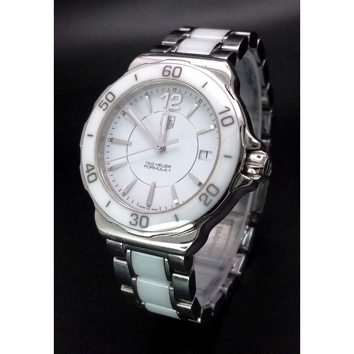 277 - A Tag Heuer Formula 1 Quartz Ladies Watch. Ceramic and steel bracelet and case - 35mm. White dial. N... 