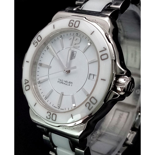 277 - A Tag Heuer Formula 1 Quartz Ladies Watch. Ceramic and steel bracelet and case - 35mm. White dial. N... 