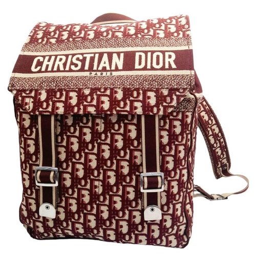 122 - A Christian Dior Burgundy Oblique Backpack. Monogram textile exterior with silver-toned hardware, ha... 