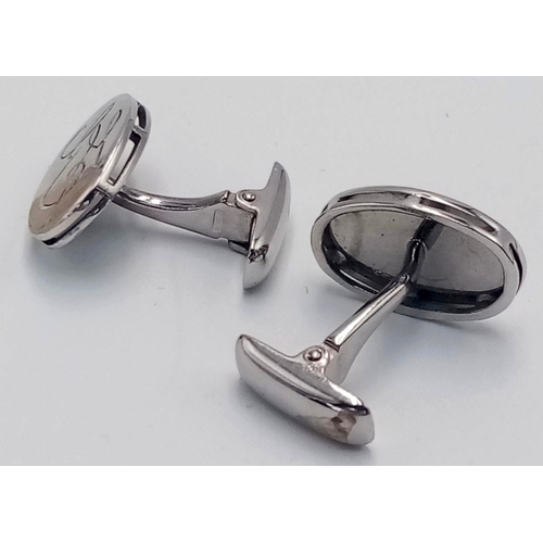 157 - A Pair of 18K White Gold Cufflinks. Oval design. 10.8g. Ref: 017916