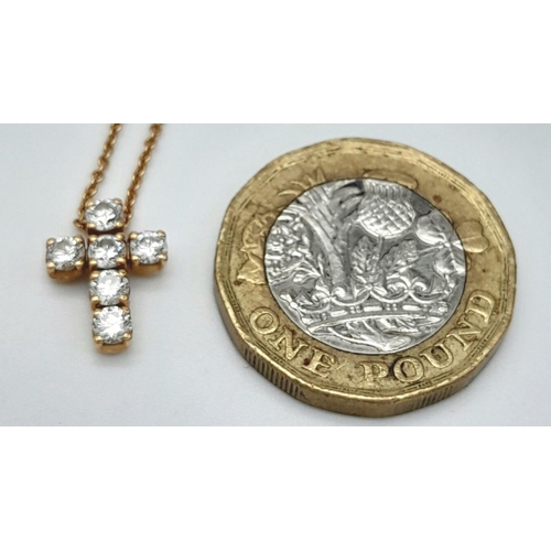 1103 - A Six Stone Diamond Cross Pendant on an 18K Yellow Gold Necklace. 0.56ctw diamonds. 1cm and 42cm. 3.... 