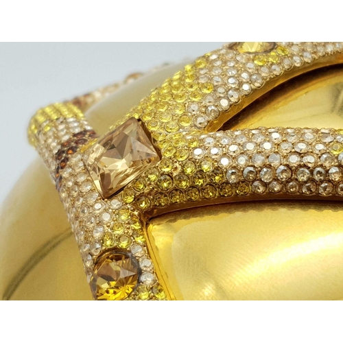 1173 - A Valentino Gold Orb Clutch Bag. Metal exterior with a stone embellished V logo and clasp fastening ... 