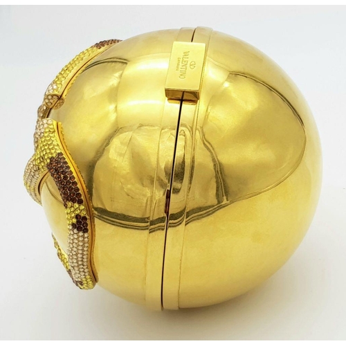 1173 - A Valentino Gold Orb Clutch Bag. Metal exterior with a stone embellished V logo and clasp fastening ... 