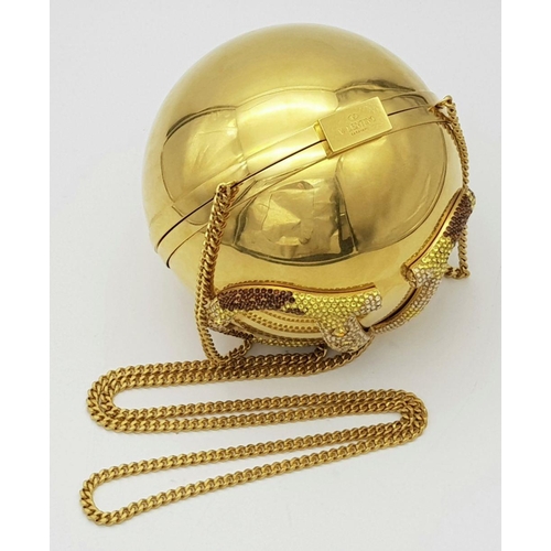 1173 - A Valentino Gold Orb Clutch Bag. Metal exterior with a stone embellished V logo and clasp fastening ... 