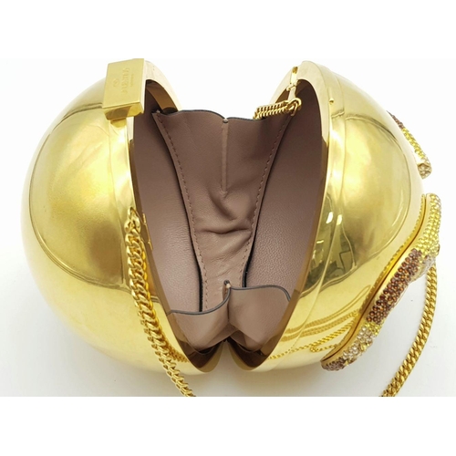 1173 - A Valentino Gold Orb Clutch Bag. Metal exterior with a stone embellished V logo and clasp fastening ... 