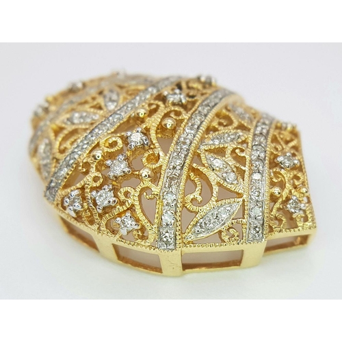 256 - A Majestic 14K Yellow Gold Diamond Encrusted Pendant. Pierced decoration with symmetrical diamond pl... 