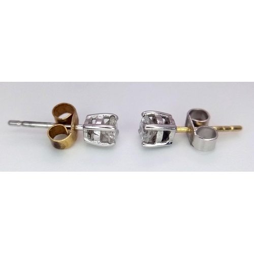 1124 - Withdrawn - A Pair of 18K Gold Diamond Stud Earrings. 0.50ctw. 1.1g total weight. Ref: 018140