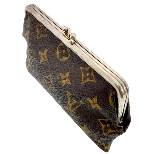 1194 - A Vintage Louis Vuitton Coin Purse. Louis Vuitton x Saks Fifth Avenue collaboration. Monogram canvas... 