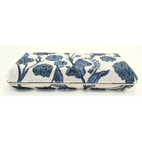 1138 - A Judith Leiber Blue Garden Clutch Bag. Crystal embellished exterior with clasp fastening closure. S... 